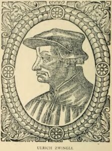 Woodcut of Huldrych Zwingli in profile, facing left, wearing a flat cap, inside an oval frame decorated with rosettes.